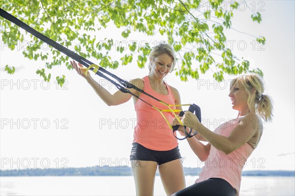 Caucasian woman working with trainer outdoors