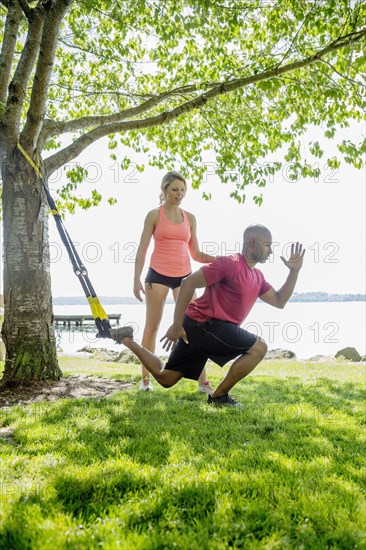 Caucasian man working with trainer outdoors