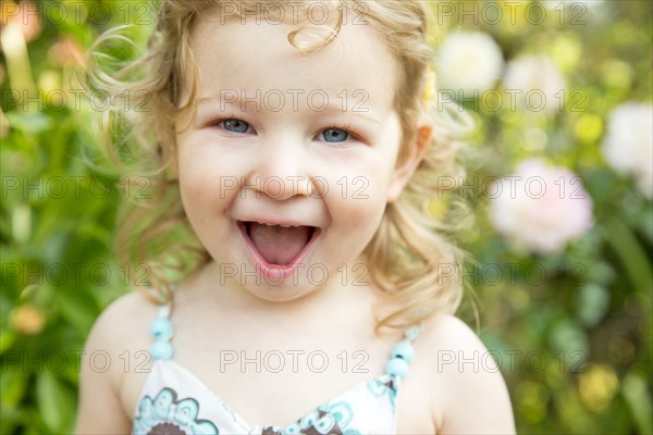 Caucasian girl smiling outdoors