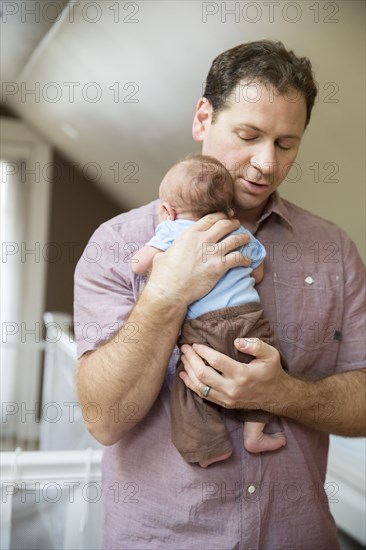 Father holding baby