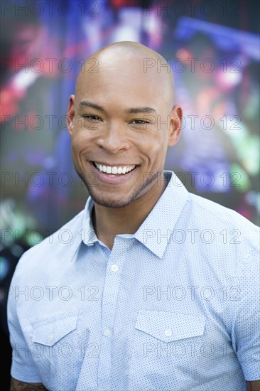 Mixed race man smiling