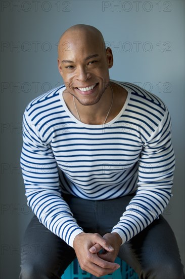 Mixed race man in striped shirt