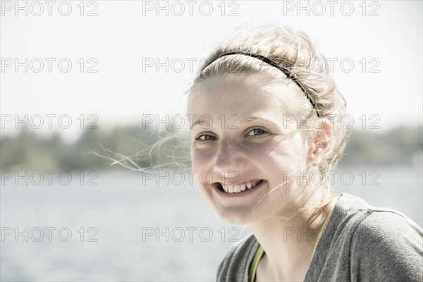 Caucasian girl smiling outdoors