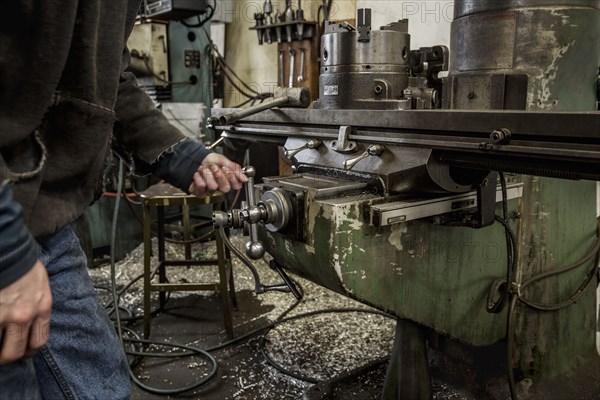 Working using machinery in metal shop