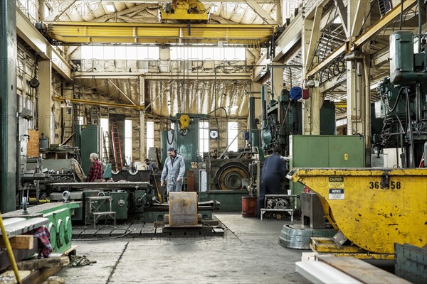 Men working in metal shop