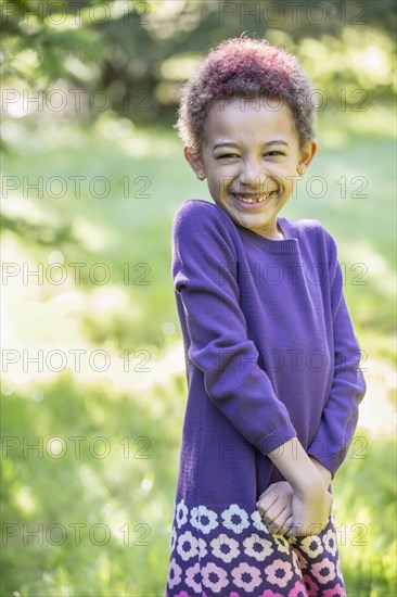 Mixed race girl smiling outdoors