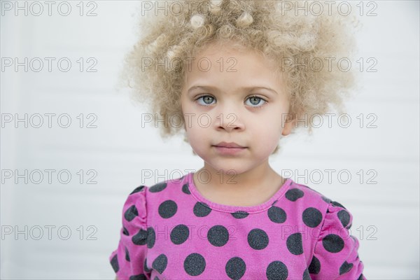 Mixed race girl standing outdoors