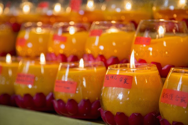 Burning candles for New Year in Buddhist temple