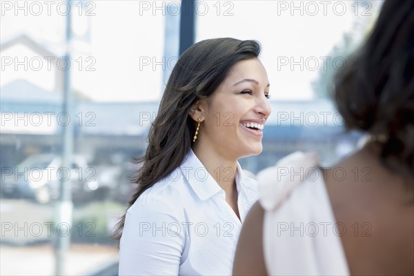 Businesswomen laughing outdoors