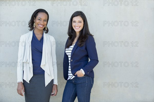 Businesswomen smiling together