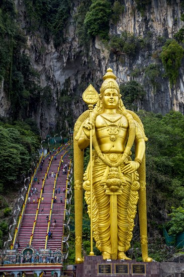 Gold statue of Murugan outside Batu Caves