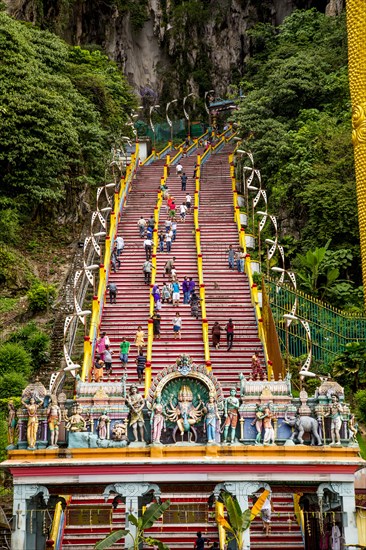 People climbing steps to Hindu shrine at Batu Caves