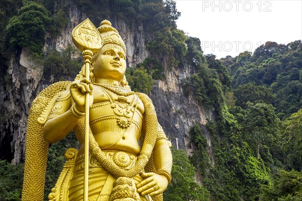 Gold statue of Murugan outside Batu Caves