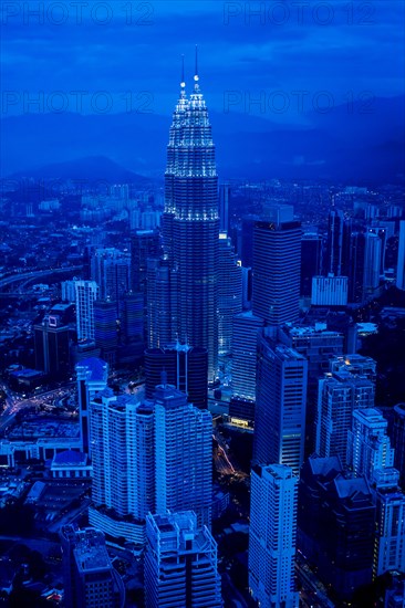 View of city skyline lit up at night