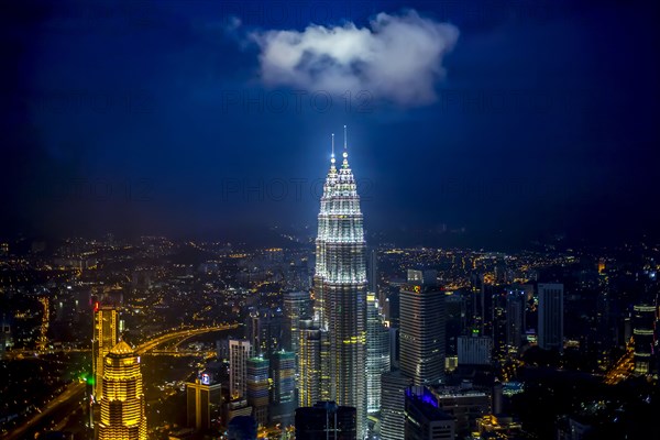 View of city skyline lit up at night