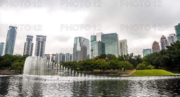 Fountain in lake in urban park