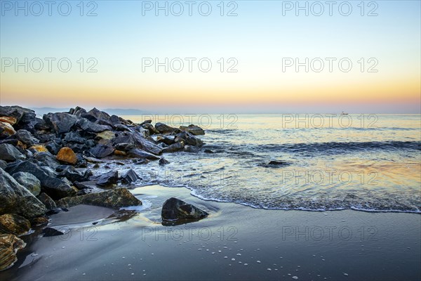 Waves washing up on rocky beach