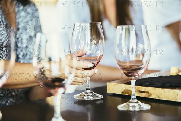 Women drinking wine together in bar