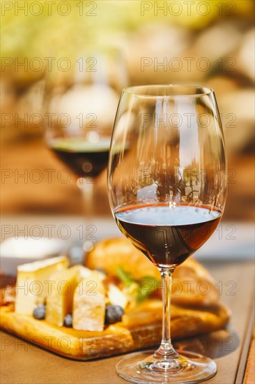 Glasses of wine with cheese and meat board