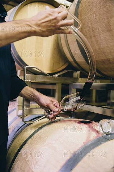 Caucasian man tasting wine