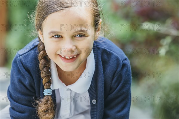 Mixed race girl smiling outdoors