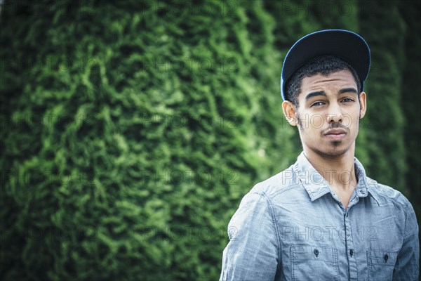 Mixed race boy standing outdoors