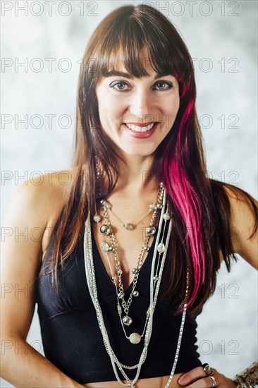 Caucasian woman with dyed hair smiling