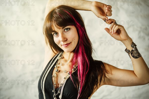 Caucasian woman with dyed hair smiling