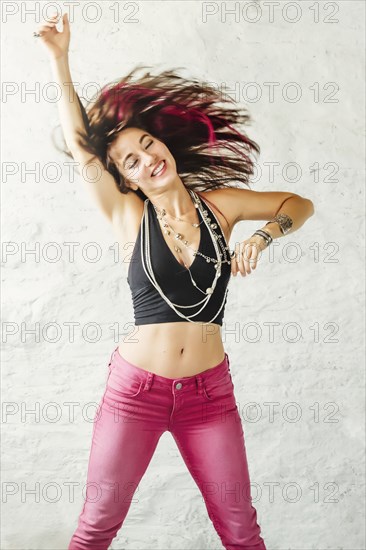 Caucasian woman jumping for joy