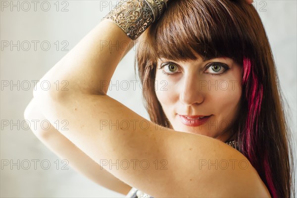 Caucasian woman with dyed hair smiling