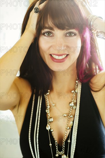 Caucasian woman with dyed hair smiling