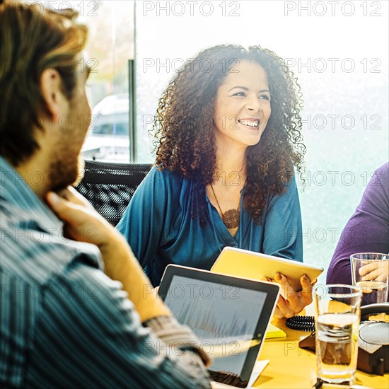 Business people using digital tablets in office meeting