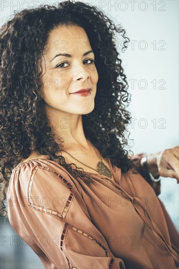 Mixed race businesswoman smiling