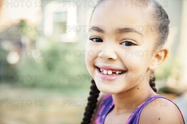 Close up of mixed race girl smiling