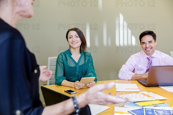 Business people talking in office meeting