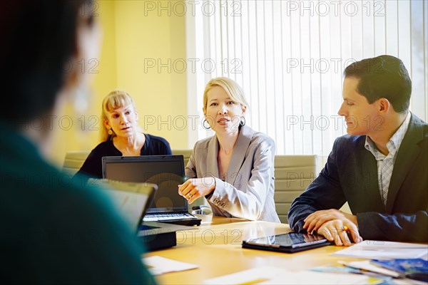 Business people talking in office meeting