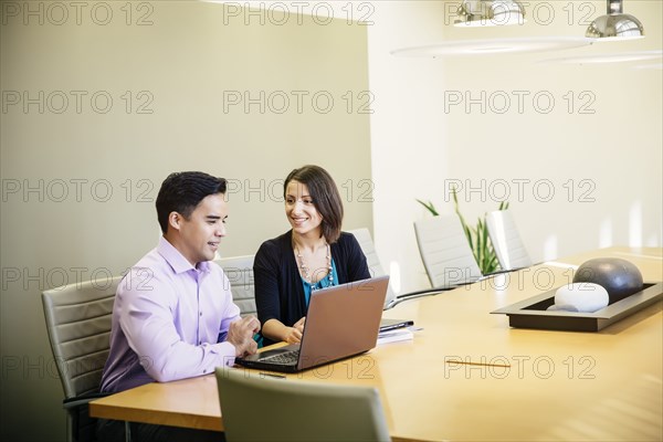 Business people talking in office meeting