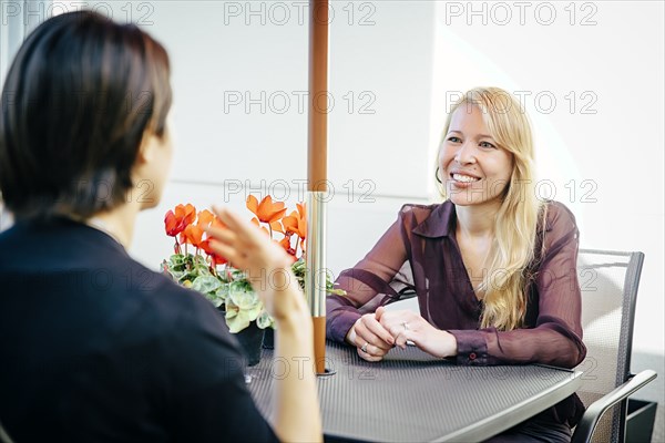 Businesswomen having lunch in cafe