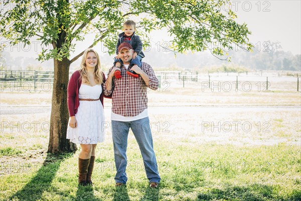 Caucasian family smiling on farm