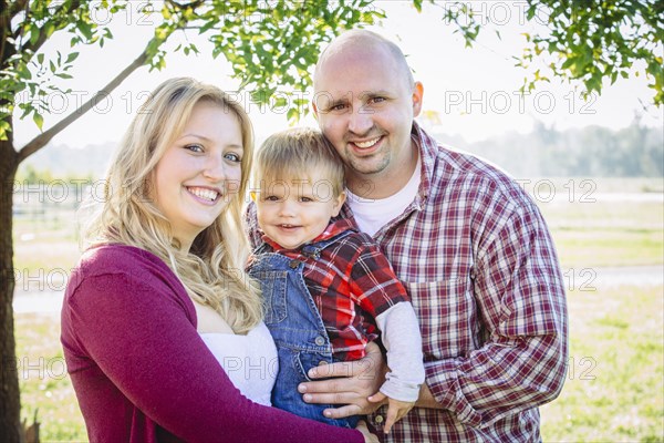 Caucasian family smiling on farm