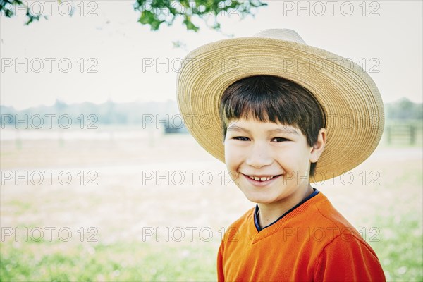 Caucasian boy smiling on farm