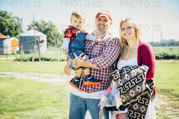 Caucasian family smiling on farm