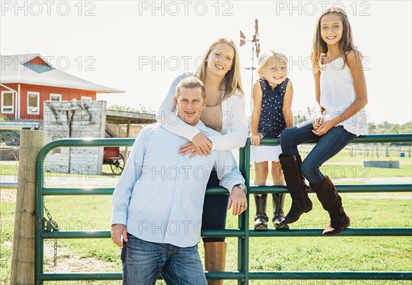 Caucasian family smiling on farm