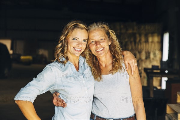 Caucasian mother and daughter hugging