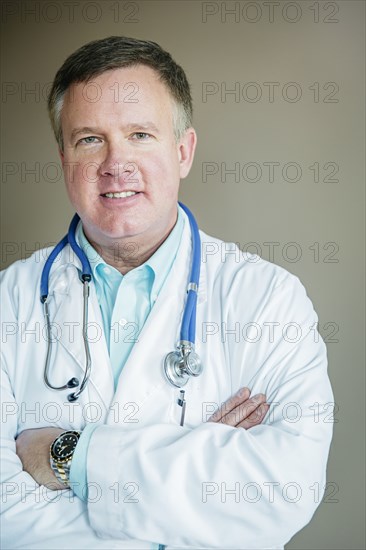 Caucasian doctor standing with arms crossed