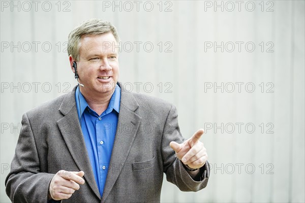 Caucasian businessman talking on headset