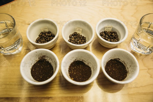 Variety of ground coffee beans in cups