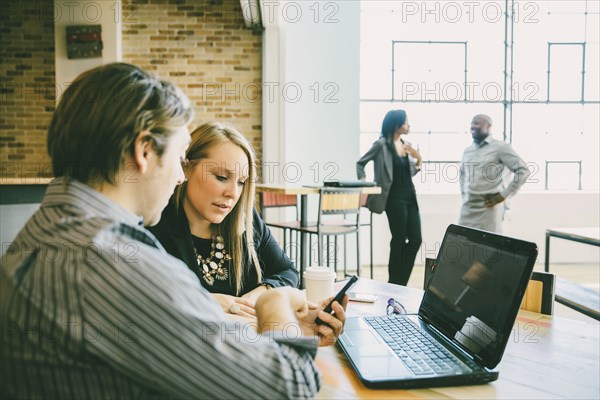 Business people talking in cafe