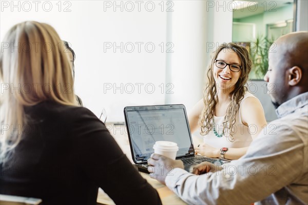 Business people working together in cafe