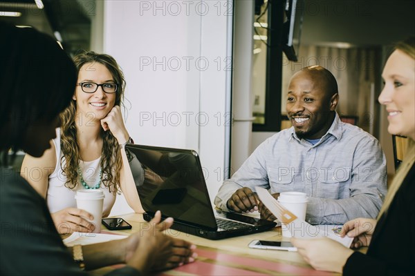 Business people working together in cafe